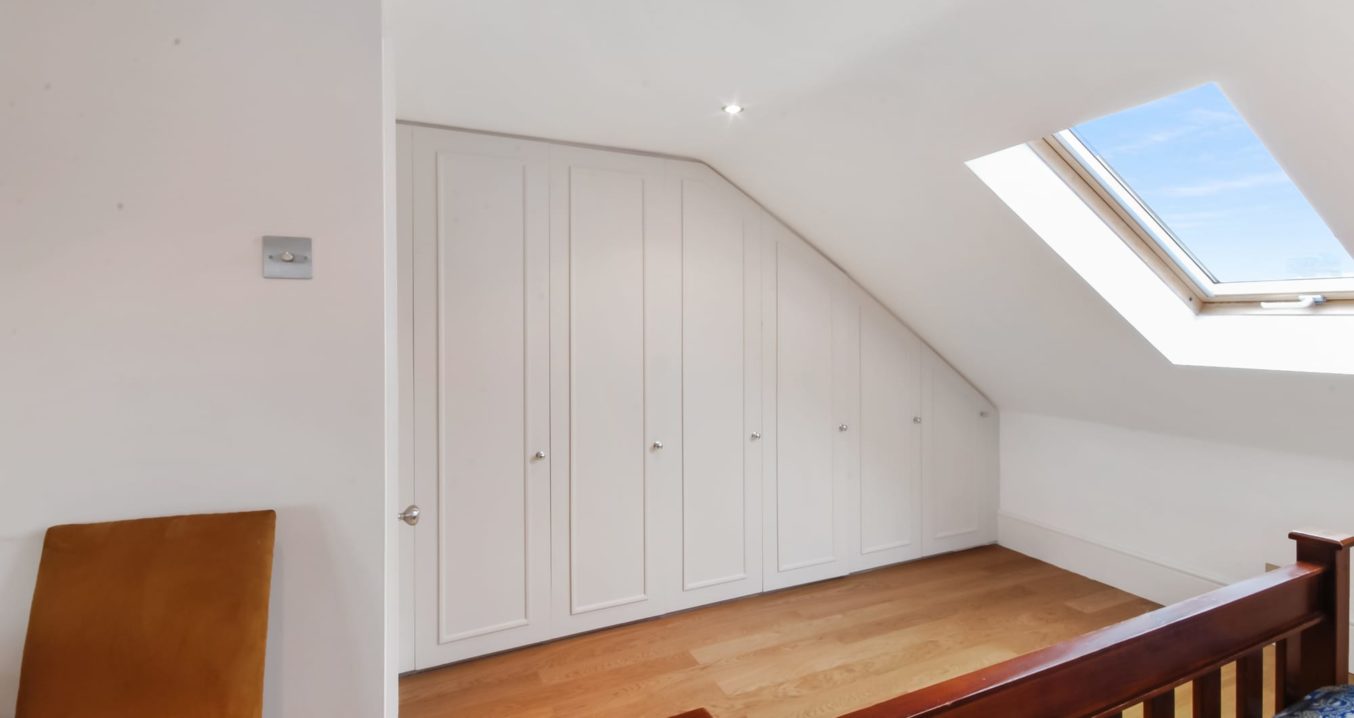 Built-in wardrobe and wooden floors in loft conversion in Kensal Green NW10 London