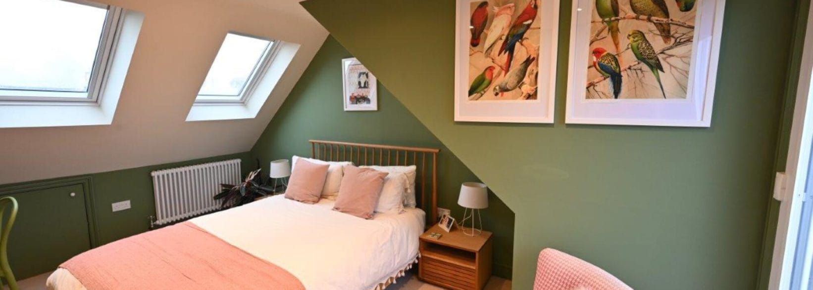 gorgeous green bedroom in a rear dormer loft conversion in Hackney, East London