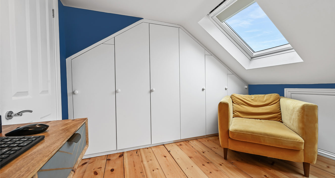 white built-in wardrobes in an Inset Dormer loft conversion, at a home in Lewisham South East London, SE13