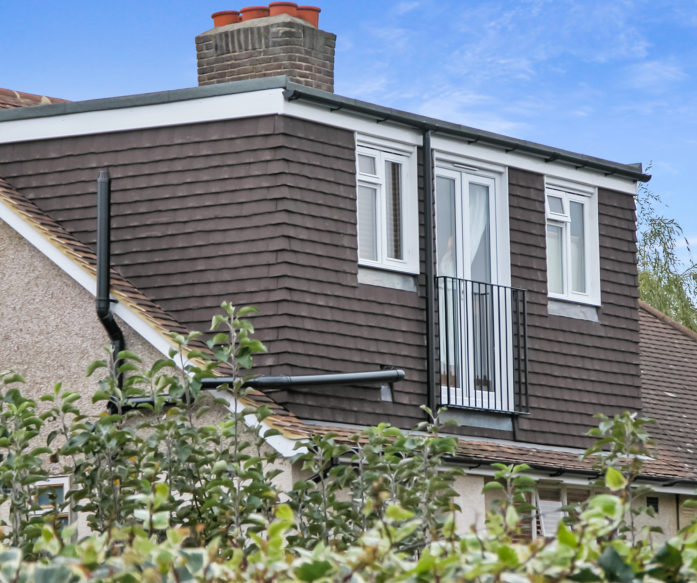 Dormer South West London, Merton, SW18 with brown tiling and French doors with railings