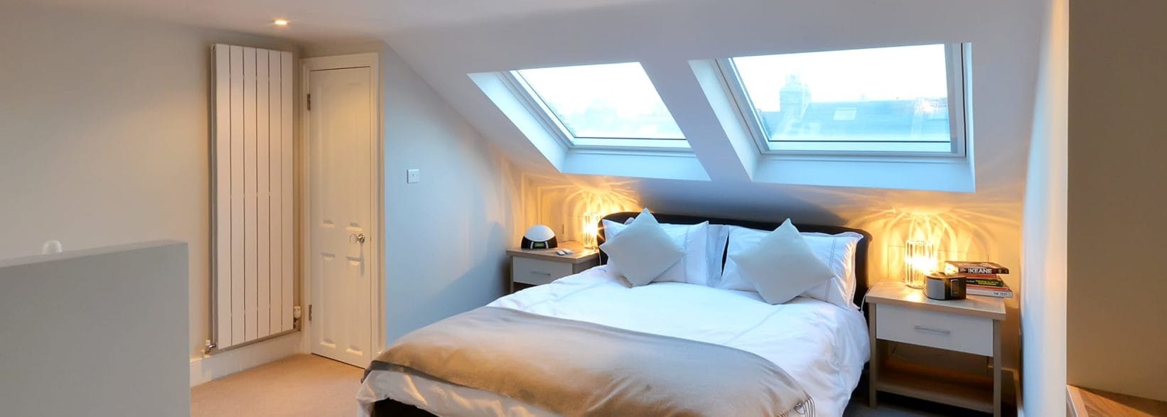 https://www.absolutelofts.com/wp-content/uploads/2020/12/loft-conversion-dormer-l-shaped-bedroom-wandsworth-sw18.jpg-1642x587.jpg?utm_source=chatgpt.com