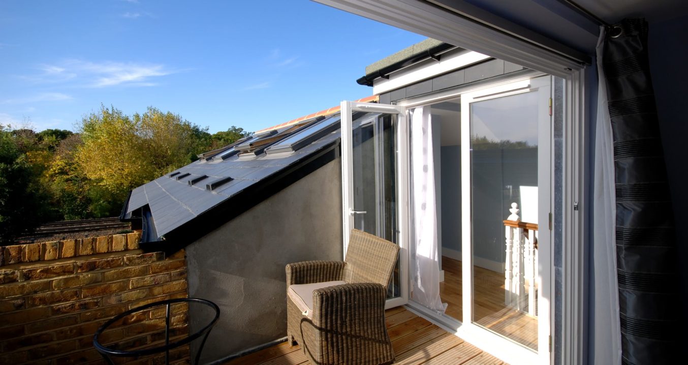 Roof terrace with french doors in a loft conversion in Southfileds SW18