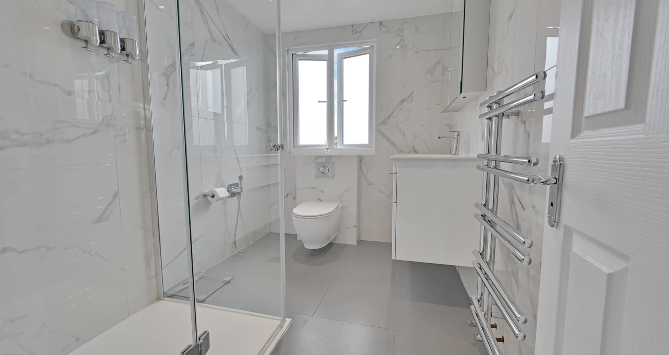 white tiled shower room in a dormer loft conversion in Norbury SW16