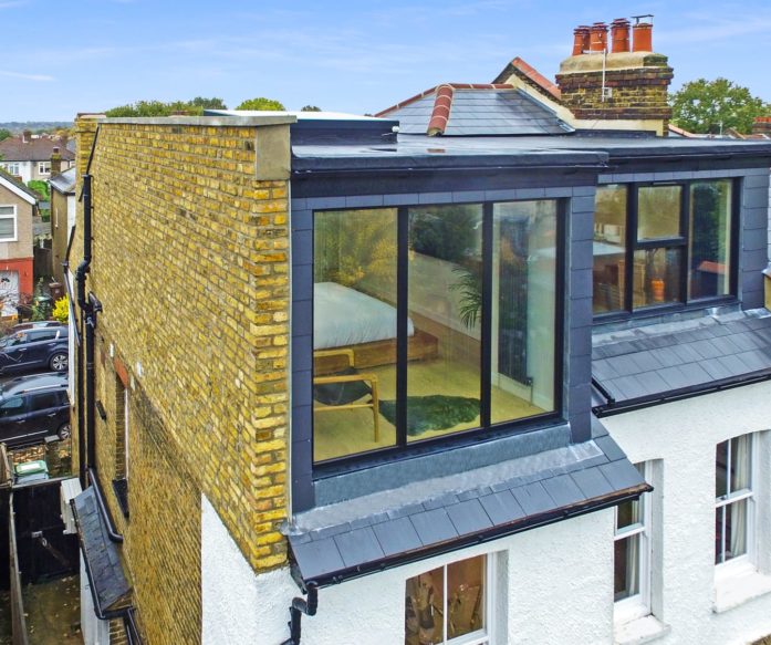 exterior view of this Hip to Gable & Dormer loft conversion with grey slating, in Hither Green South East London SE12