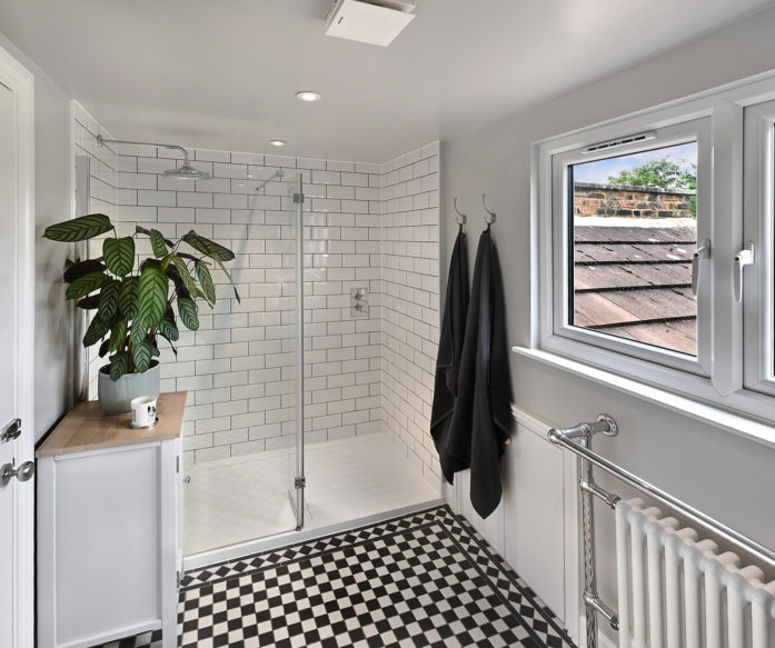 black and white bathroom, in an L-shaped Dormer loft conversion, at a home in Hither Green South East London, SE6