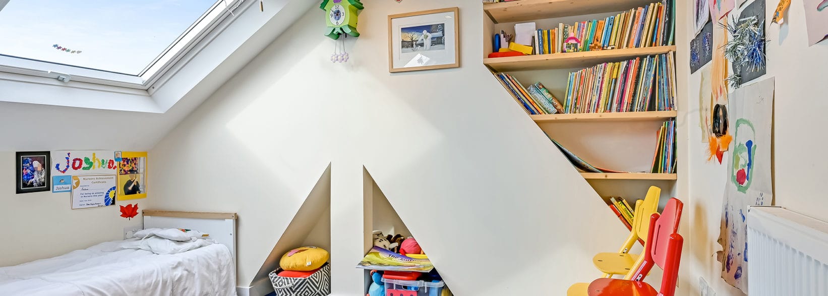 colourful playroom in an L-Shaped Dormer loft conversion, at a home in Tooting South West London, SW17
