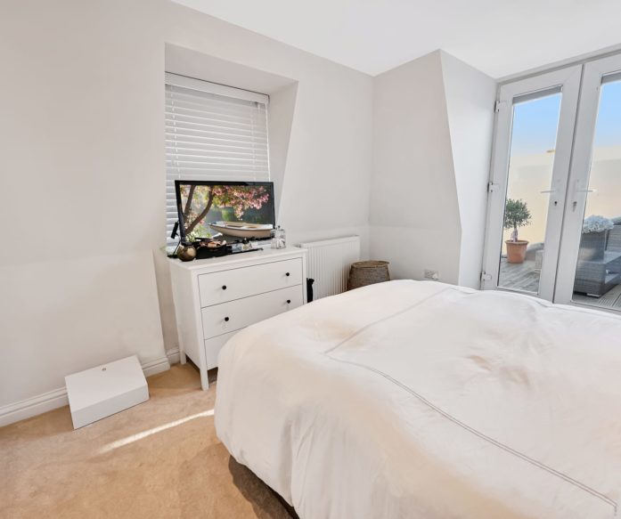 Mansard loft conversion created a spaciousbedroom, en-suite and french doors in Tooting SW17