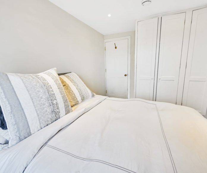 white themed room in an L-Shaped Mansard loft conversion at a home in Tooting South West London, SW17