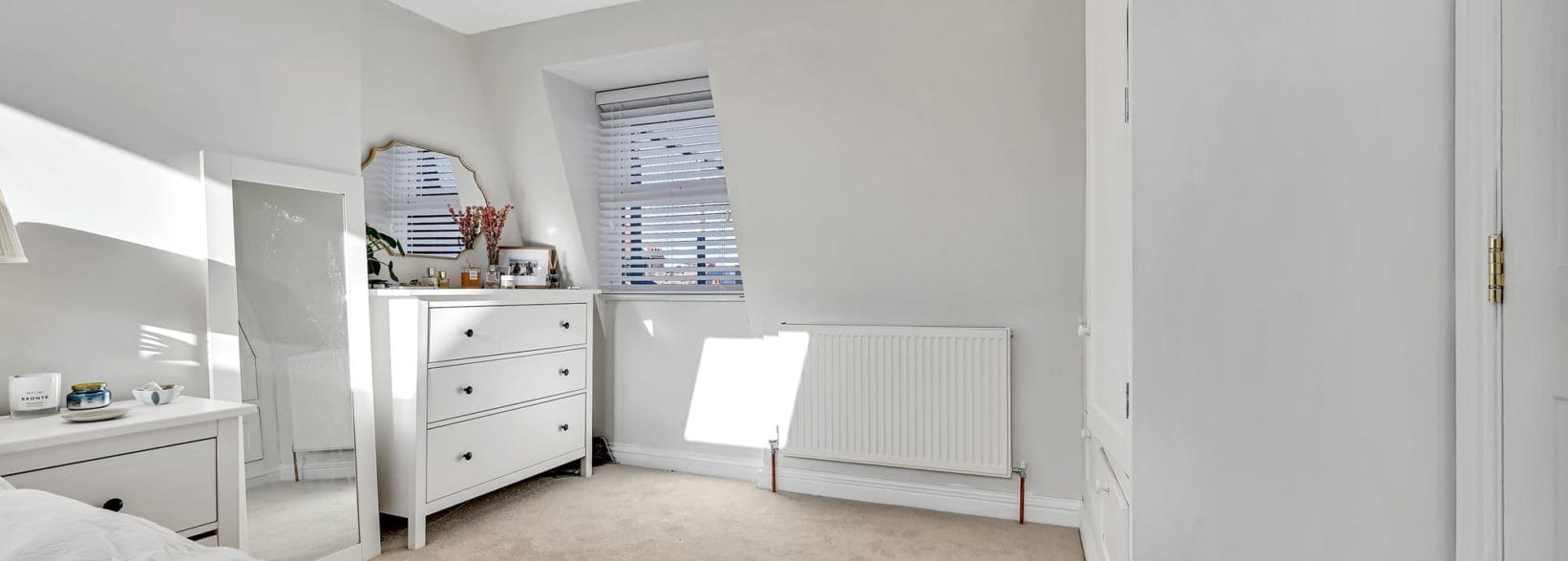 bedroom with en-suite in an L-Shaped Mansard loft conversion at a home in Tooting South West London, SW17