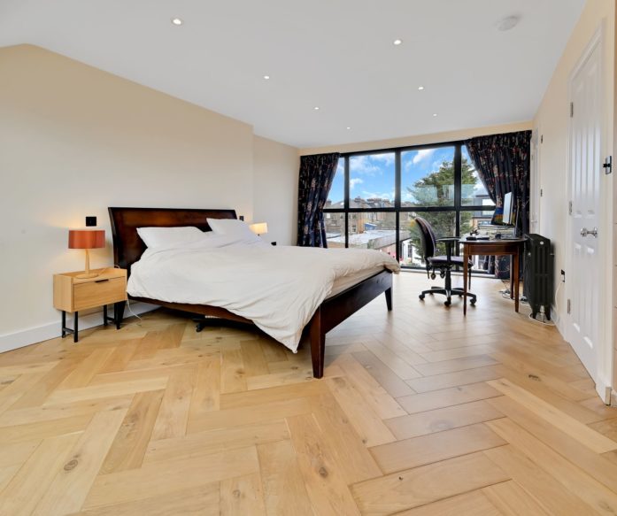 loft conversion dormer Loft Bedroom with wooden floor in Willesden Green NW2