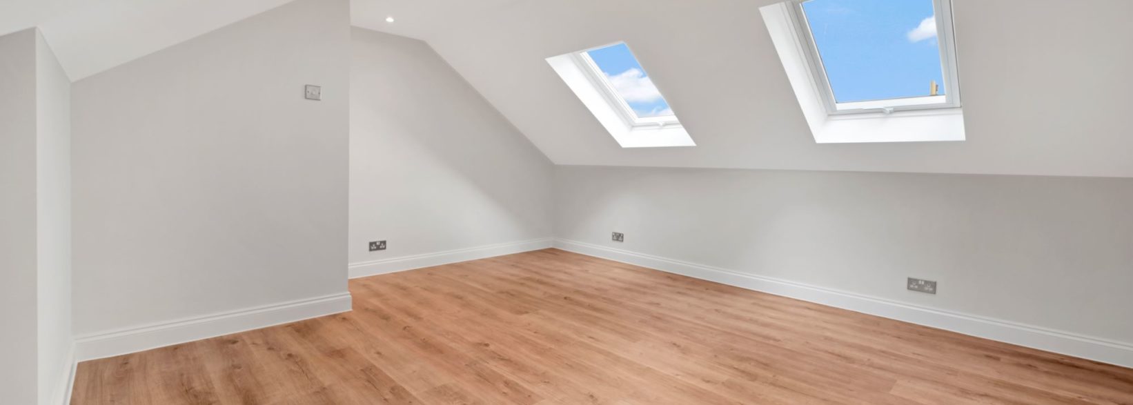 Light and chic Bedroom with hardwood floor East London