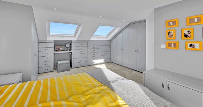 Beautiful bedroom in L Shaped loft conversion at a home in Hornchurch RM14 Essex in calm grey with Velux windows