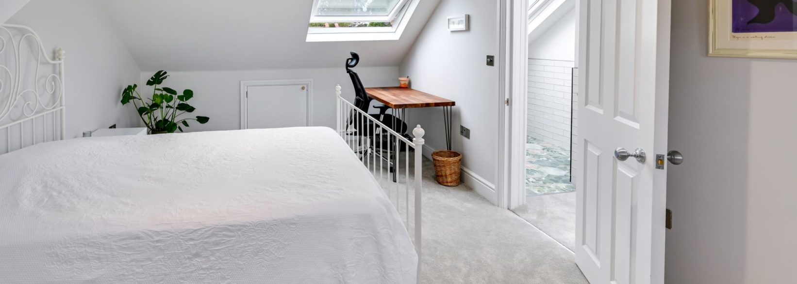 Bright bedroom with Velux window. Part of an inset dormer loft conversion in Epping, Essex