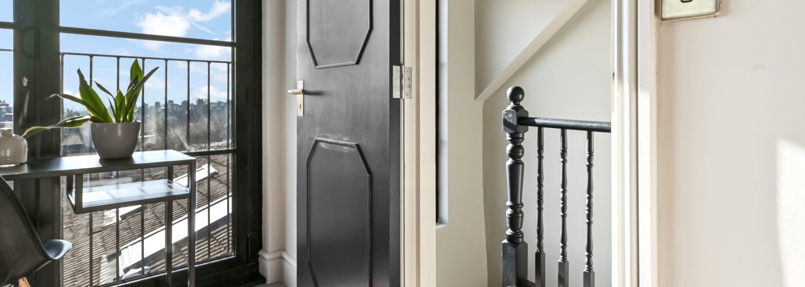 Floor-to-ceiling window adding light to spacious dormer loft conversion in St Albans Hertfordshire