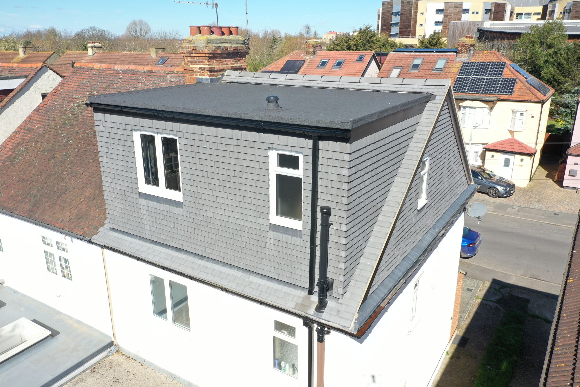 hip to gable loft conversion woolwich se18 rear dormer flat roof grey slate cladding