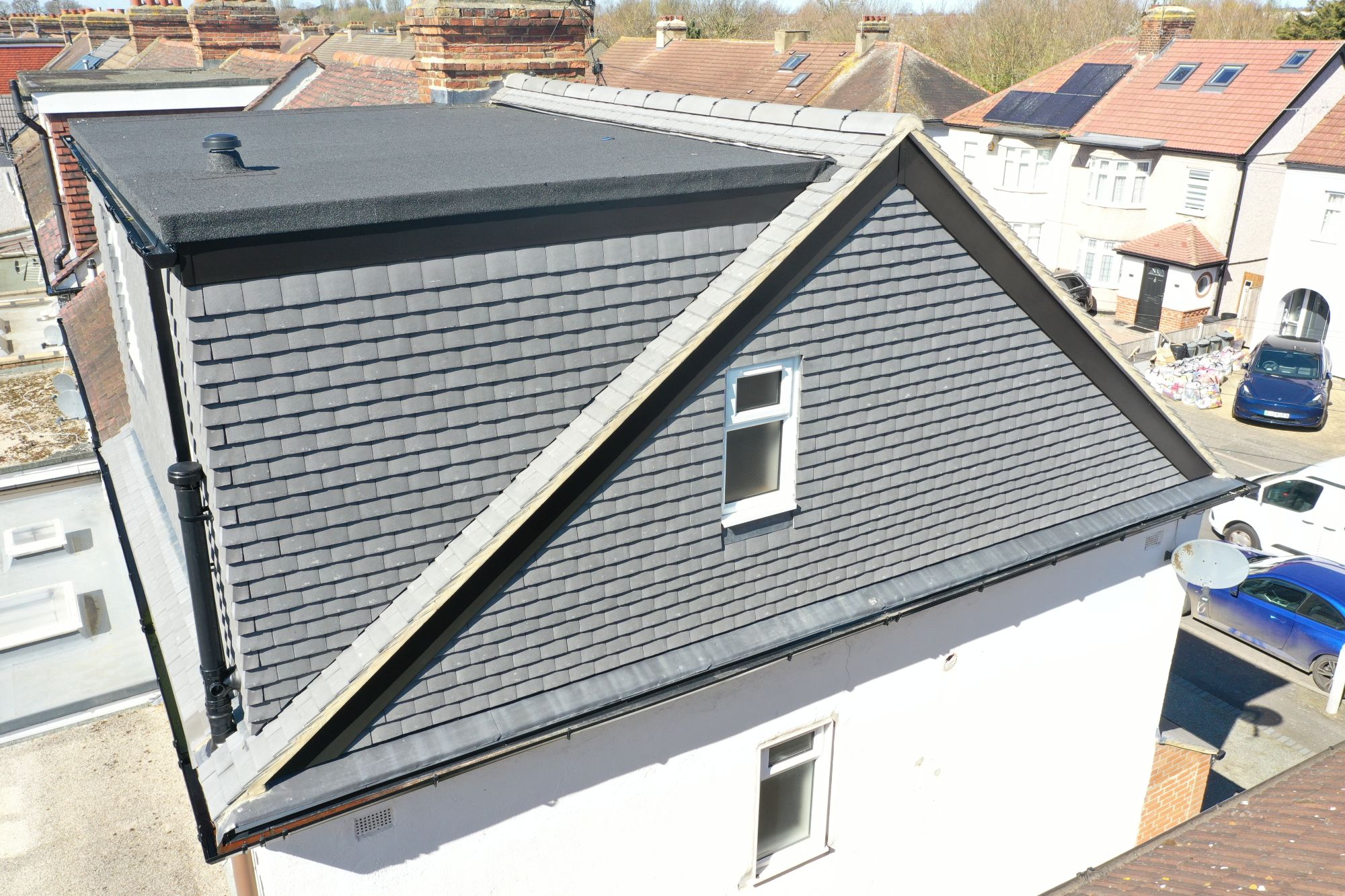 hip to gable loft conversion woolwich se18 new gable wall slate tiles window detail