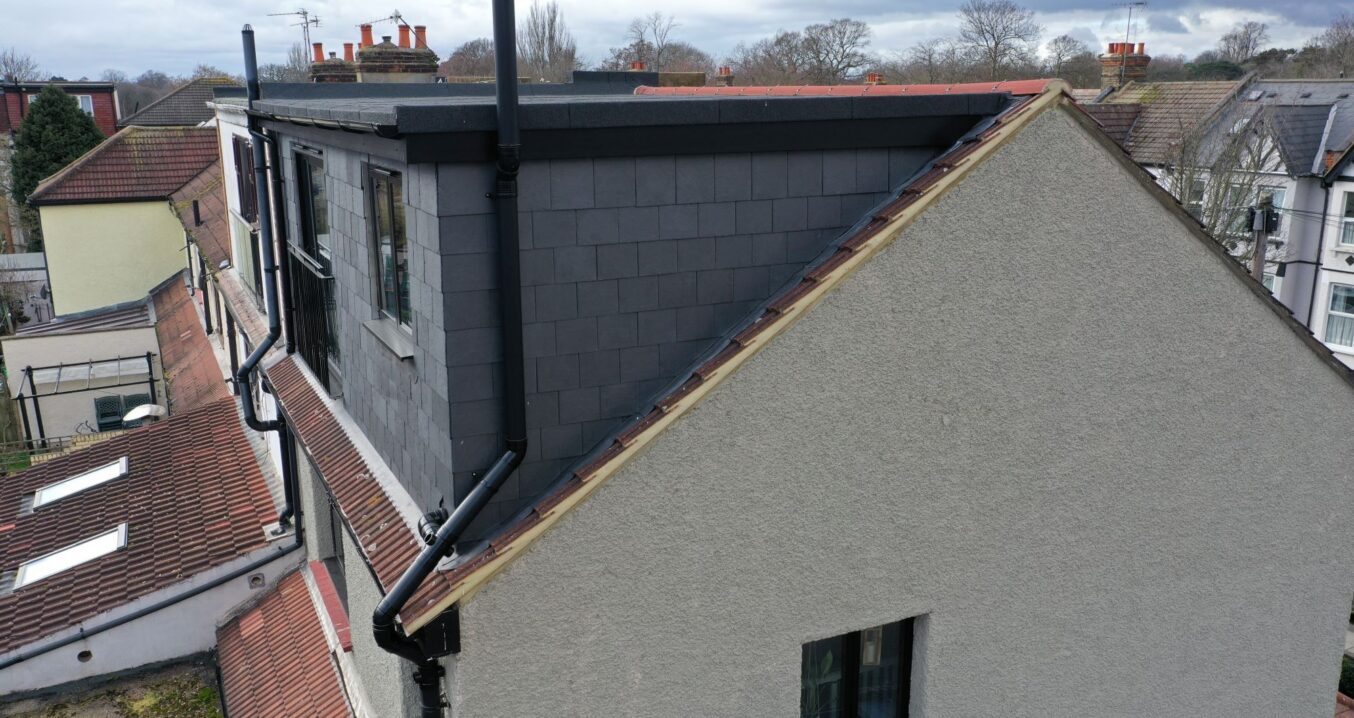 Exterior dormer loft conversion roof view with cladding and drainage detail for Archway content