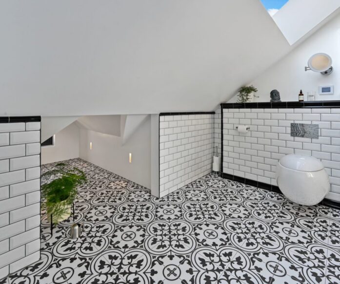 Modern black and white loft bathroom Leytonstone E11 with patterned tiles