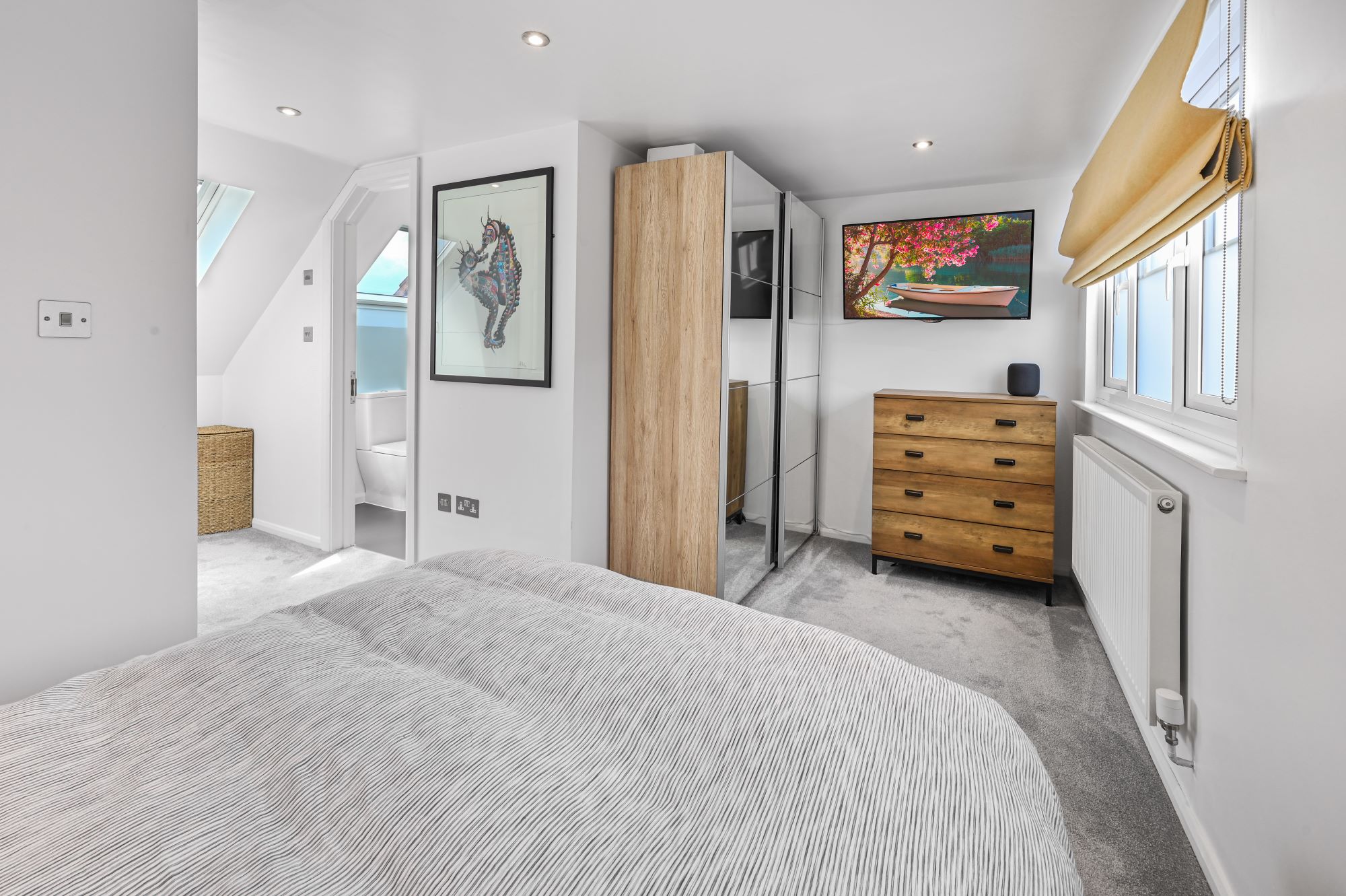 Dormer loft bedroom with fitted wardrobes, grey carpet and en suite access, suitable for loft conversion homes in Norwood SE25.