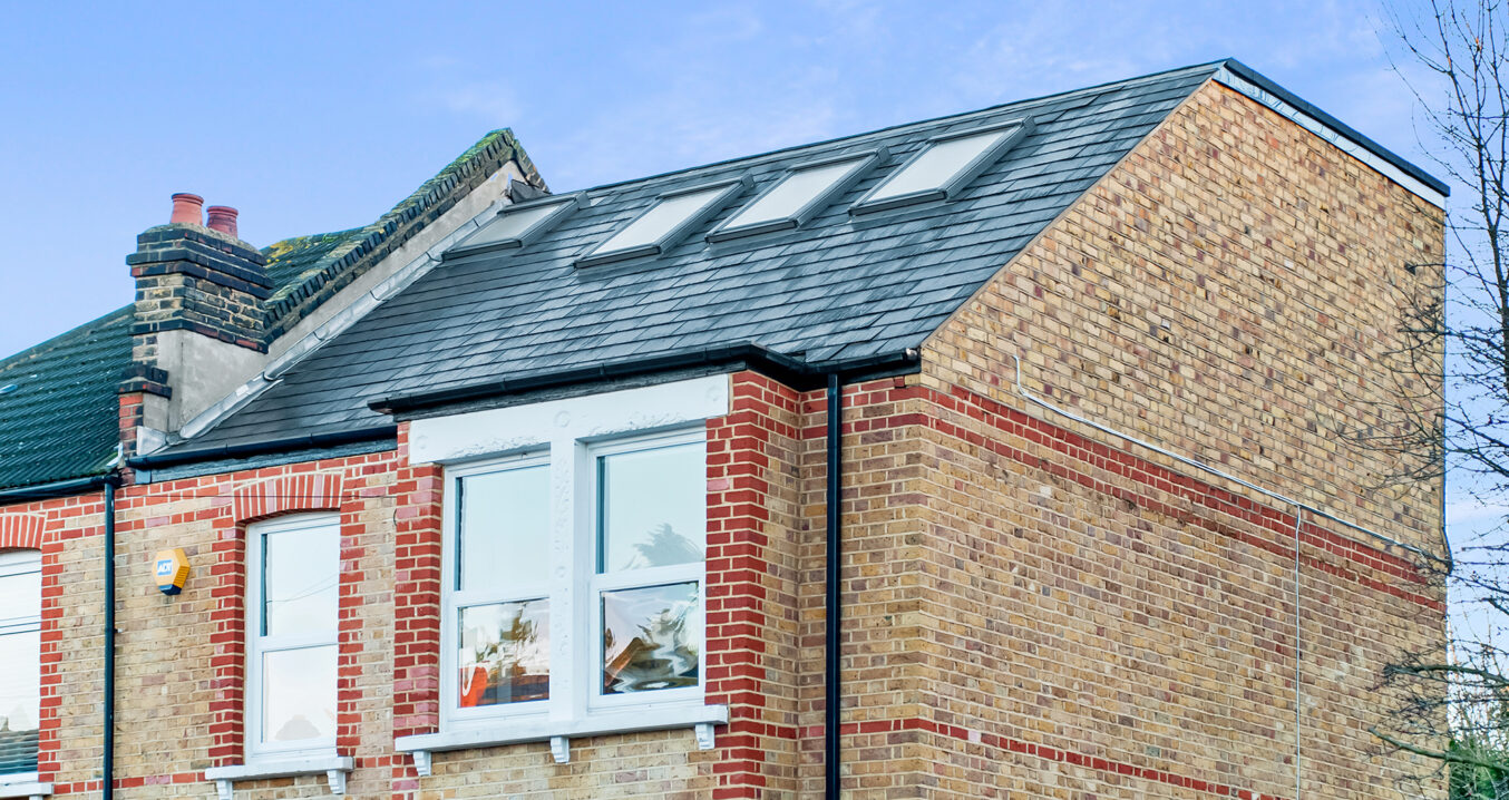 Completed hip-to-gable loft conversion on a brick house in Edgware showing new dormer, rooflights and clean roof extension