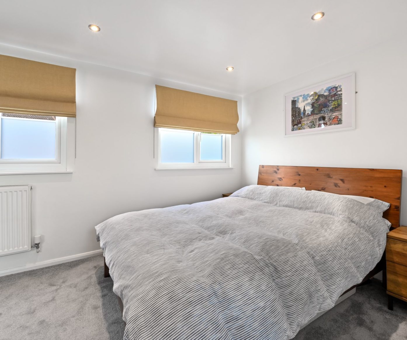 Dormer loft conversion bedroom in Balham with grey carpet flooring and bright spacious interior