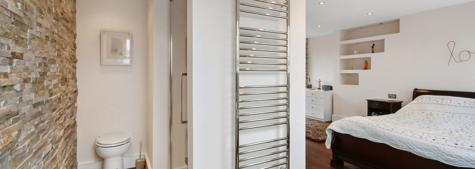 En suite shower room connected to a Borehamwood loft conversion master bedroom