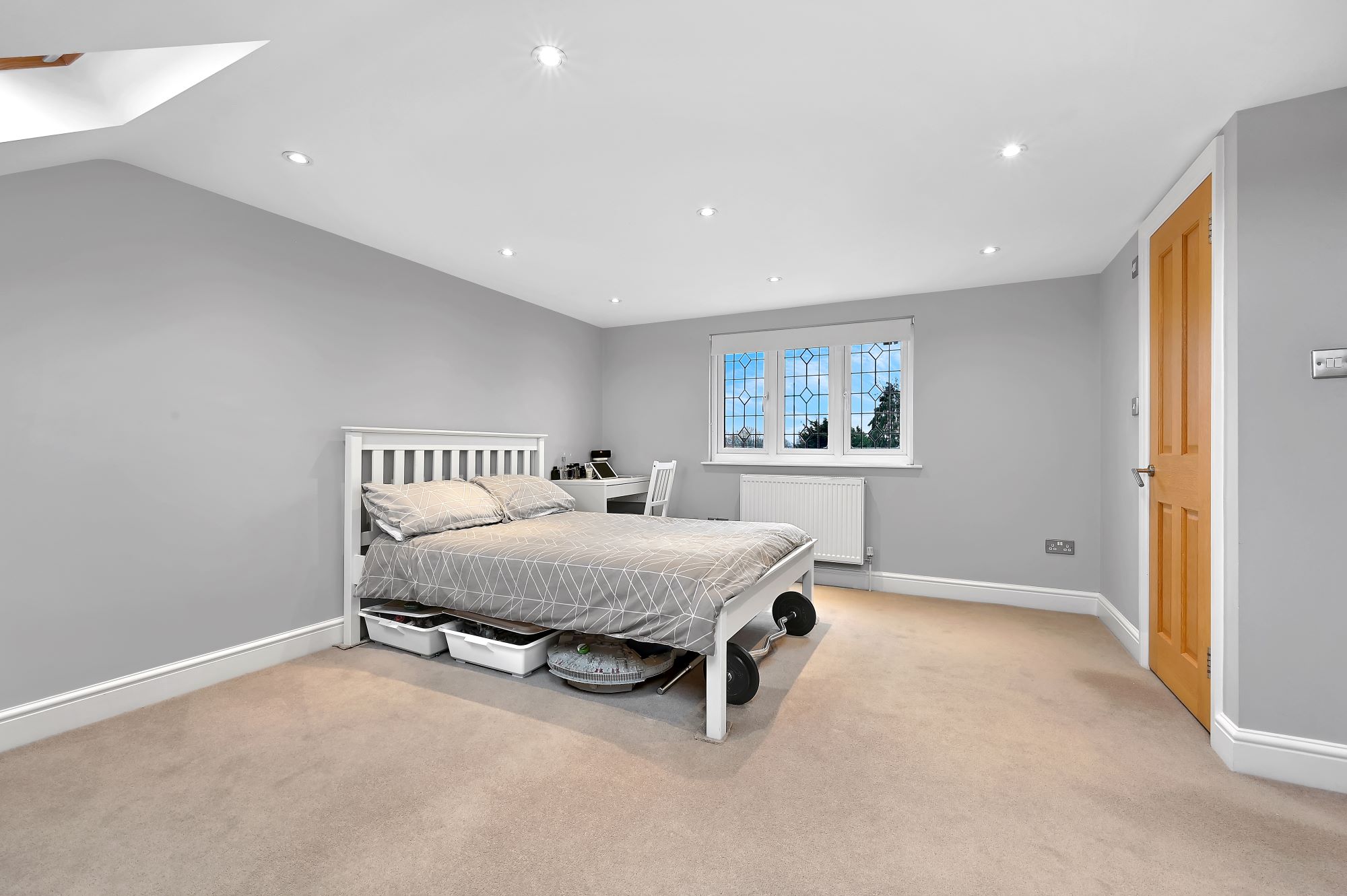 Spacious dormer bedroom in a Borehamwood loft conversion with large floor area and modern finish