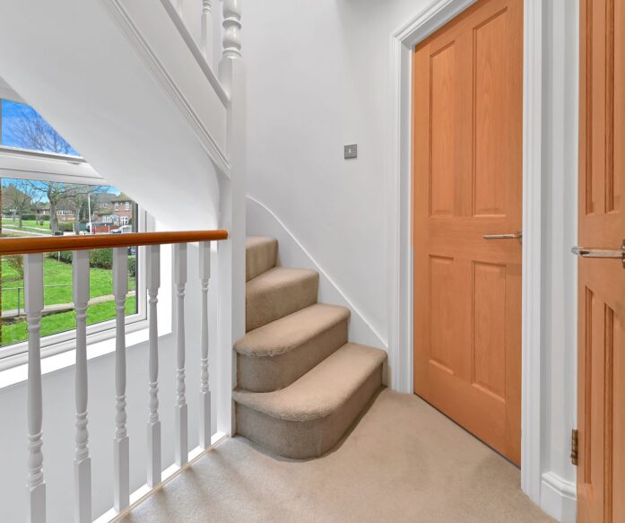Loft conversion staircase in Mill Hill with bright landing, fitted carpet and smooth access to upper floor