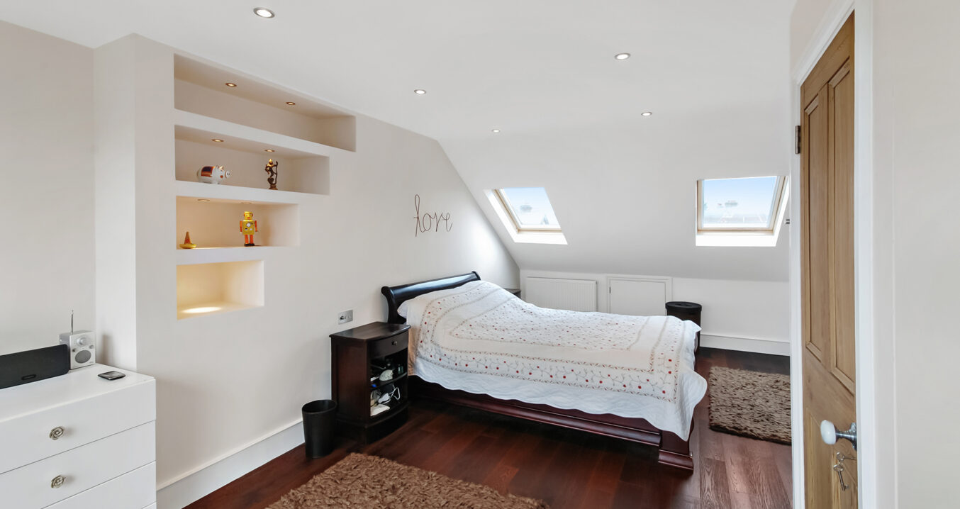 Loft conversion bedroom in Sidcup with en suite shower room and fitted storage