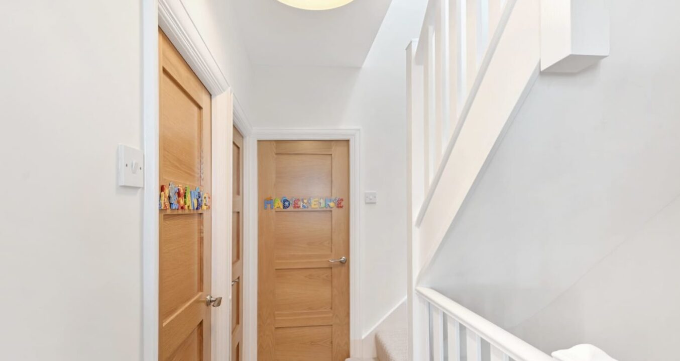 Newly built staircase and landing with natural wood doors in a dormer loft conversion Walthamstow E17