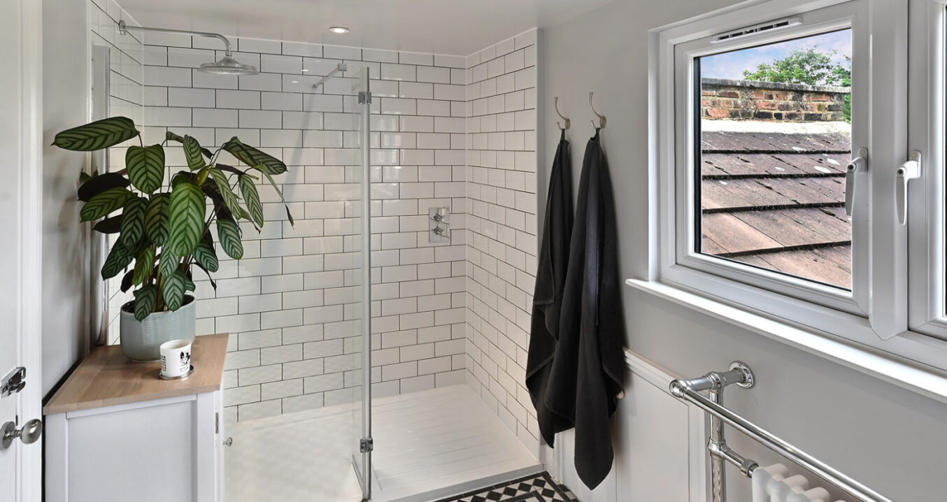 Modern black and white en-suite shower room in loft conversion Leytonstone E11