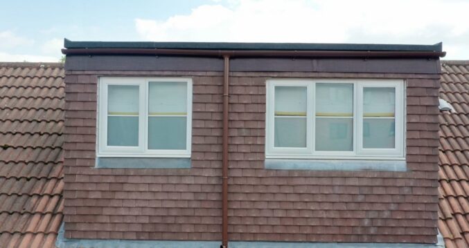 Rear dormer loft conversion exterior in Bromley with tiled cladding and double bedroom windows