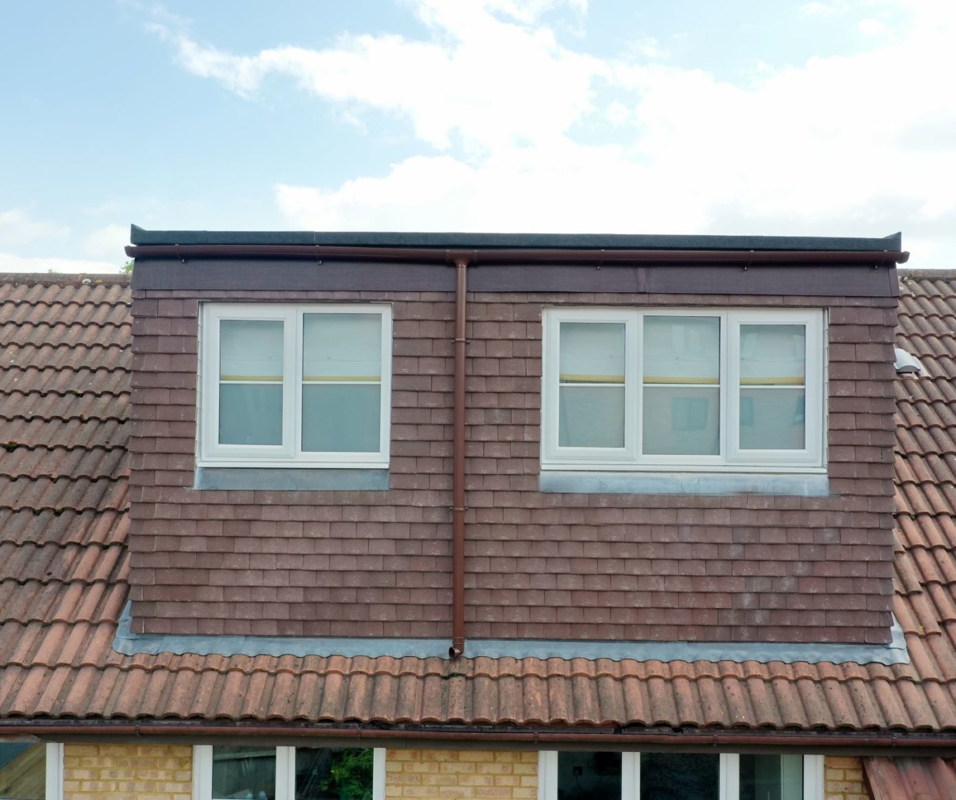 Rear dormer loft conversion exterior in Bromley with tiled cladding and double bedroom windows