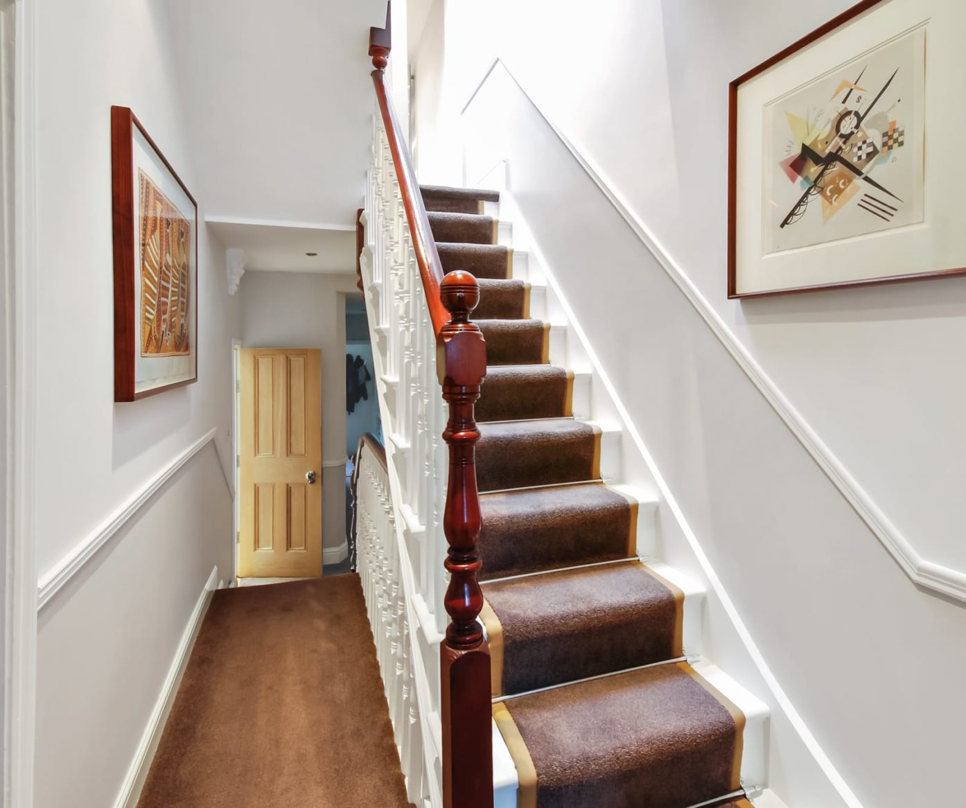Traditional staircase leading up to the loft with period detailing and carpet runner in Palmers Green N13.