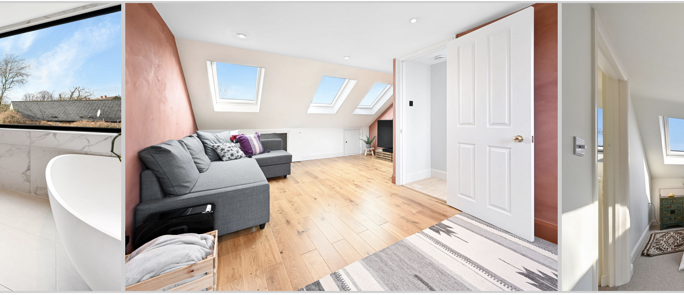 Open loft living space with rooflights, sofa area, timber flooring and bedroom area, supporting Crystal Palace loft conversion content.