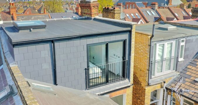Rear loft exterior with French doors, grey cladding, roof-level view and neighbouring roofs, supporting Crystal Palace loft conversion content.