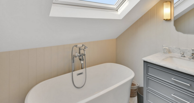 Loft home office with fitted desks, storage and a glazed door leading to a balcony in Winchmore Hill N21