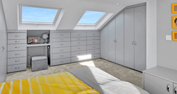 Loft conversion bedroom with bespoke fitted wardrobes, drawers and Velux roof windows, featured on the Billericay CM12 Our Work page