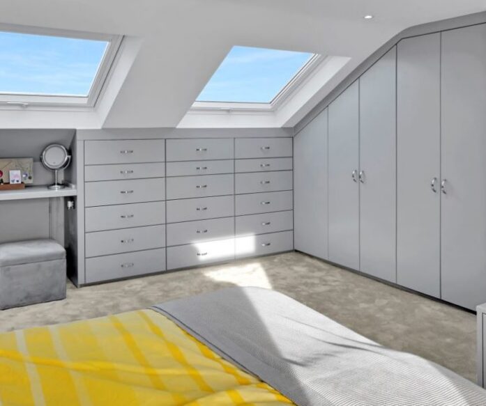 Loft conversion bedroom with bespoke fitted wardrobes, drawers and Velux roof windows, featured on the Billericay CM12 Our Work page